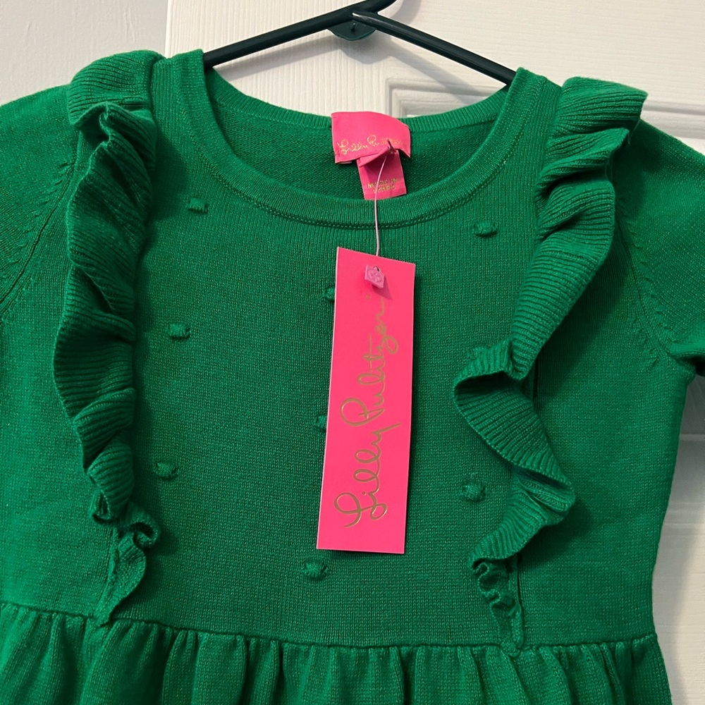 Adorable just in time for Christmas green dress with beautiful frill design.